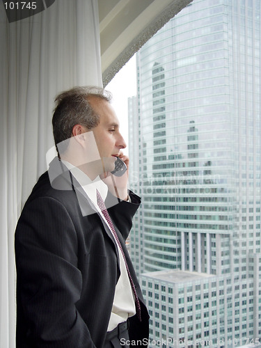 Image of Businessman  by the window