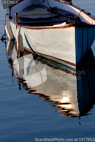 Image of Morning light on a grey boat 