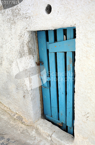 Image of Blue Door of Abandoned House