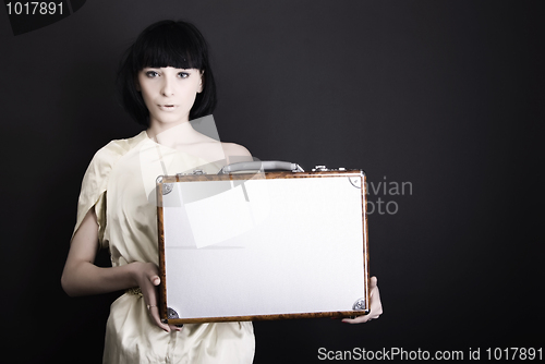 Image of A girl with suitcase 