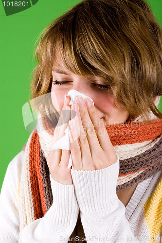 Image of cold girl sneezes