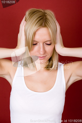 Image of woman covering her ears 