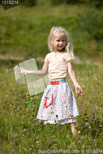 Image of girl with wild flowers