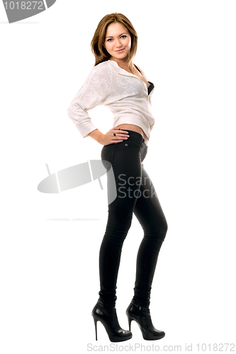 Image of Beautiful smiling girl in black tight jeans