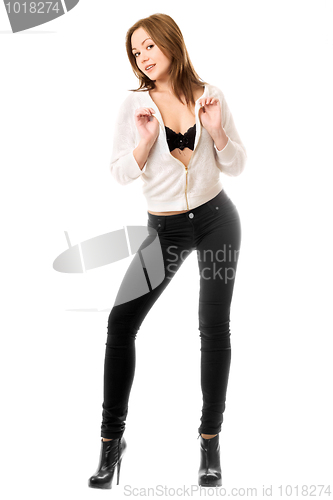 Image of Pretty young woman in black tight jeans