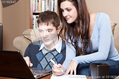 Image of Couple paying bills by online banking