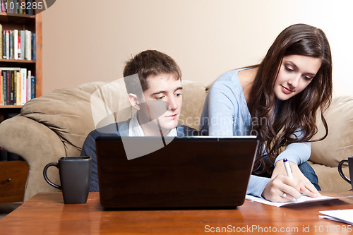 Image of Couple paying bills by online banking