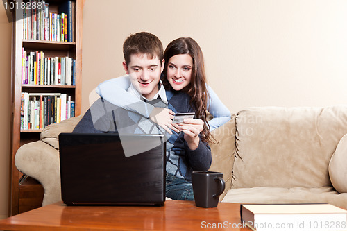 Image of Happy couple shopping online