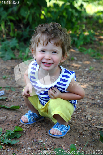 Image of smiling baby in summer garden