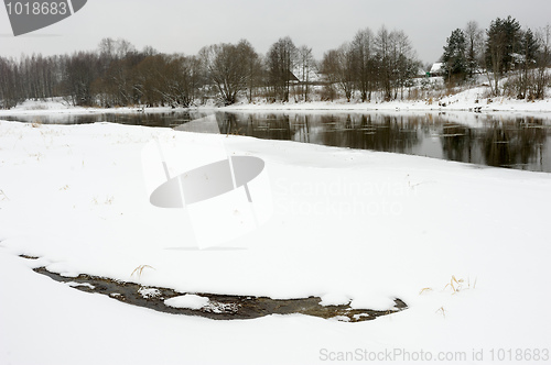 Image of Winter rustic landscape with river.