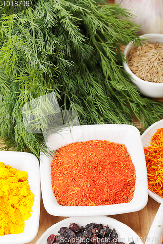 Image of Various spices on wood