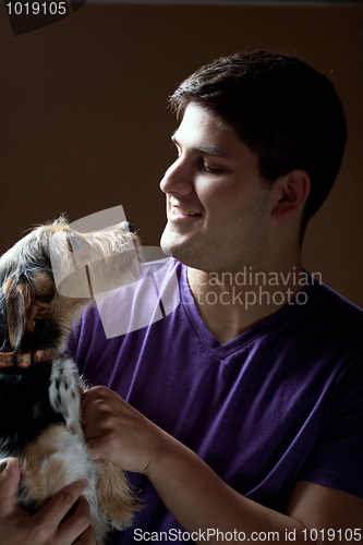 Image of Man Holding His Dog