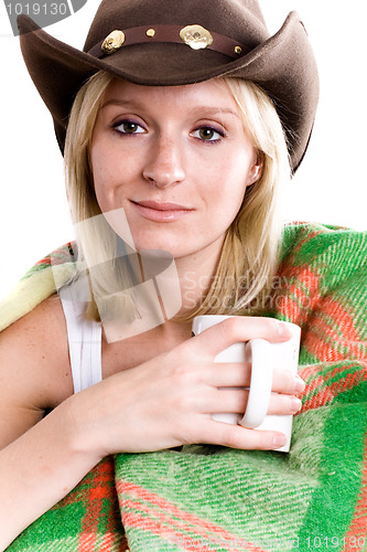 Image of girl in a cowboy hat with cup of tea 