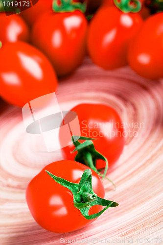 Image of tomatoes on wooden table