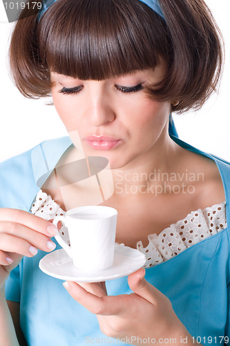 Image of woman enjoying a cup of coffee