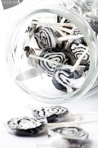 Image of Black lollipops on white