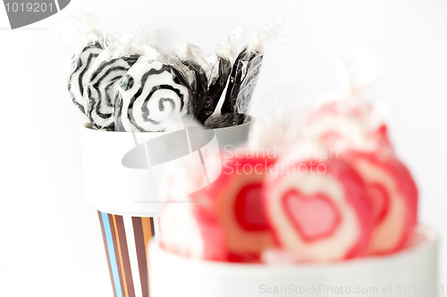 Image of Blak and pink lollipops