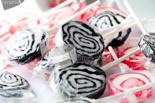 Image of Black and pink lollipops