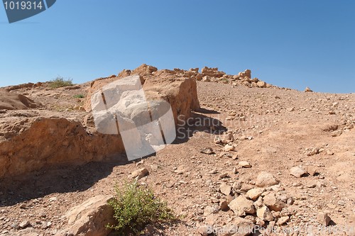 Image of Ruined wall of ancient fortress in the desert