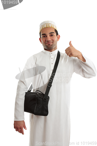 Image of Ethnic man thumbs up approval