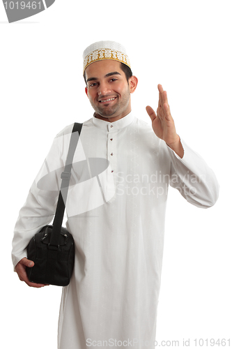 Image of Friendly ethnic man waving