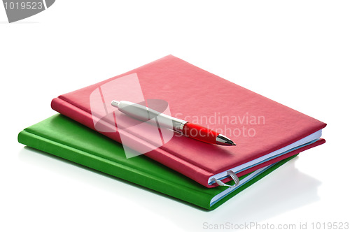 Image of Pencil with a notebook. A close up
