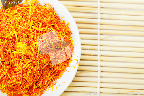 Image of Saffron leaves spice on mat above view