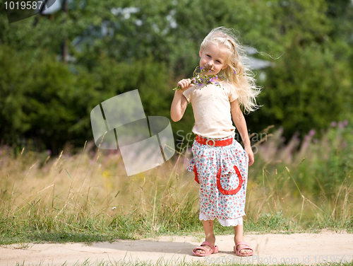 Image of girl with wild flowers