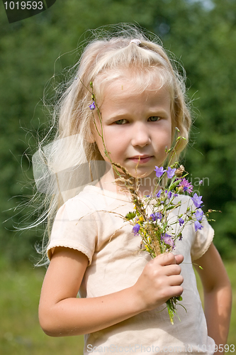Image of blonde girl with wild flowers