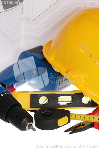 Image of Tools and helmet of the builder, it is isolated on white