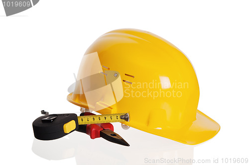 Image of Tools and helmet of the builder, it is isolated on white