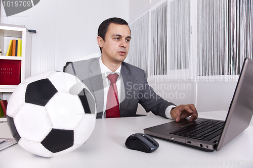 Image of Soccer manager at the office