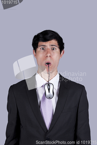 Image of Businessman eating technology