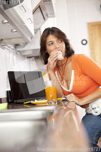 Image of Woman eating her breakfast