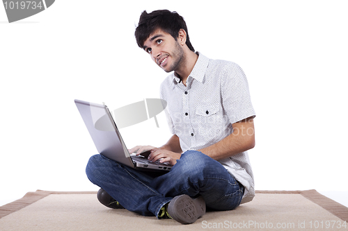 Image of Happy young man surfing the internet