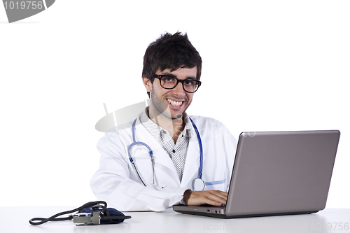 Image of frendly young doctor working with his laptop