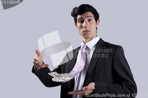 Image of Businessman with a flying necktie with money