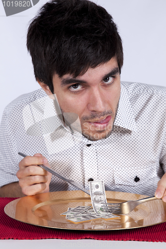 Image of Man eating little dollar banknote