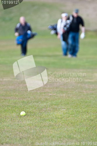 Image of Golfers walking towards ball