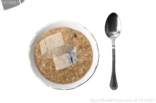 Image of spoon and a plate with a porridge