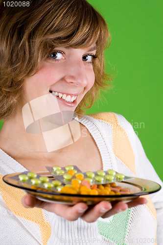 Image of woman with heap of pills