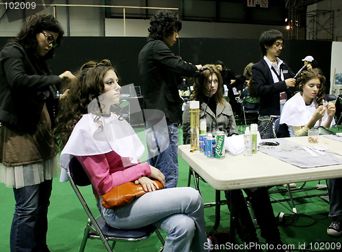 Image of Korean stylists prepare models for the runway