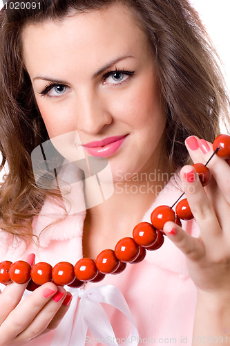 Image of attractive brunet woman with red beads