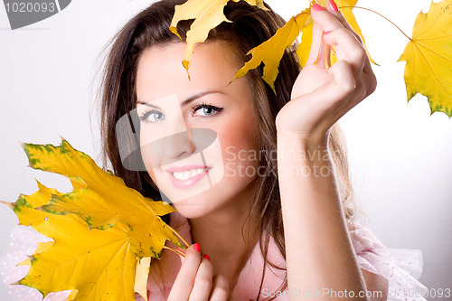 Image of woman with yellow leaves 
