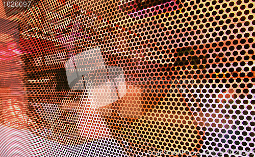 Image of glass screen with perforated pattern