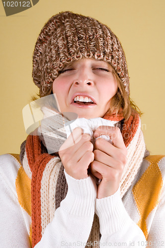 Image of cold girl sneezes 