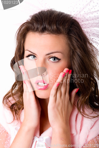 Image of girl with hands near her face