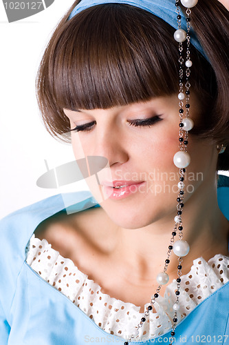 Image of brunet woman with pearl beads