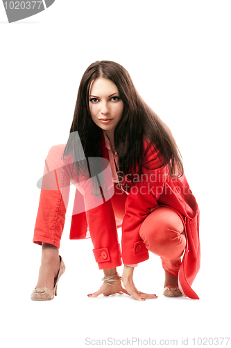 Image of Attractive young woman in red suit. Isolated