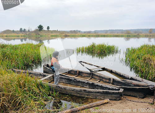 Image of The boy and the boat.